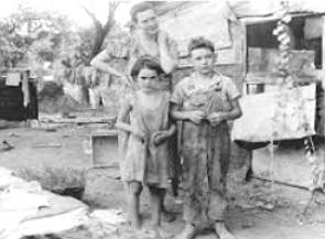 Foto mostrando uma família muito pobre dos EUA, após a Crise de 1929